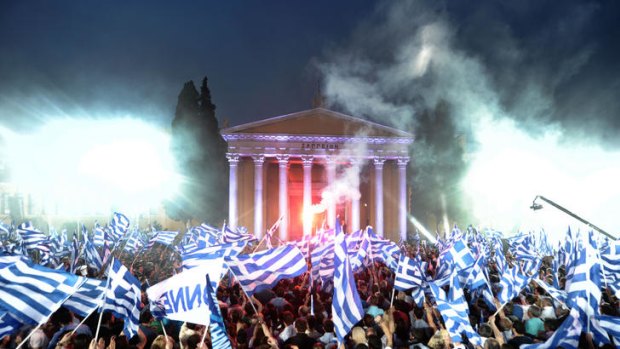 New Democracy supporters in Athens cheer amid speculation their party will struggle in elections.