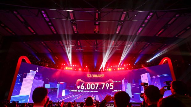 China's Singles Day online shopping festival just past midnight with a screen showing the transaction volume in Shenzhen in southern China's Guangdong province on November 11. China's online shoppers turn over tens of billions of dollars annually and it is a ready way to access the world's richest market.