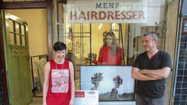 Hair razing ... festival curators Robyn Wilson and Michael Joyce, with artist Rose Vickers and one of her photos behind them.