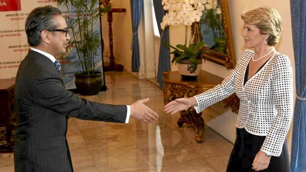 Australian Foreign Minister Julie Bishop is greeted by Indonesian counterpart Marty Natalegawa before their meeting in Jakarta, Indonesia.