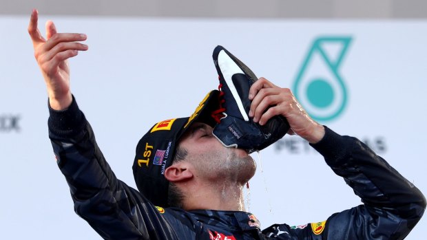 Bubbling over: Daniel Ricciardo celebrates his first ever F1 grand prix win in Malaysia.