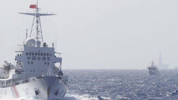 Ships of Chinese Coast Guard are seen near Chinese oil rig Haiyang Shi You 981 (right) in the South China Sea, about 210 km off shore of Vietnam.