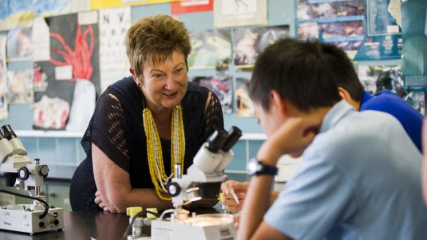 Lyneham High School principal Colleen Matheson speaks to students in the year 8 science class at the school.