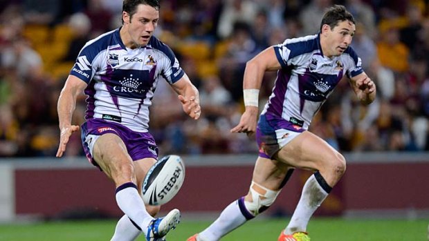 Dynamic duo ... Cooper Cronk kicks for Billy Slater.