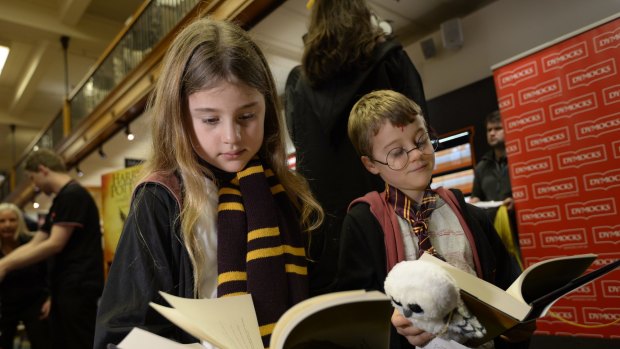 Lauren and Daniel Hurst from Mosman check out the new Harry Potter book at Dymocks in Sydney Photo: Wolter Peeters