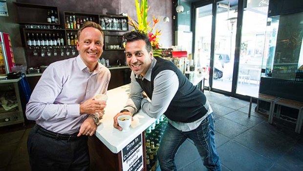 Declan Jacobs (left), a founder of the Suspended Coffee Society Melbourne, with Petros Prokopis, manager of Amici Bakery in Prahran, one of the first to get involved.