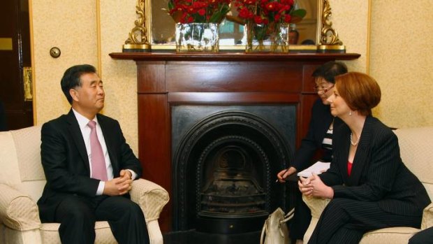 Wang Yang, left, secretary of the Guangdong Committee of the Communist Party of China, talks with Australian Prime Minister Julia Gillard at Kirribilli House.