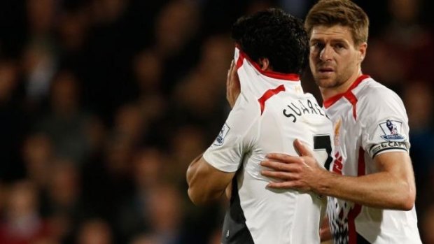 A tearful Luis Suarez is consoled by his captain Steven Gerrard.