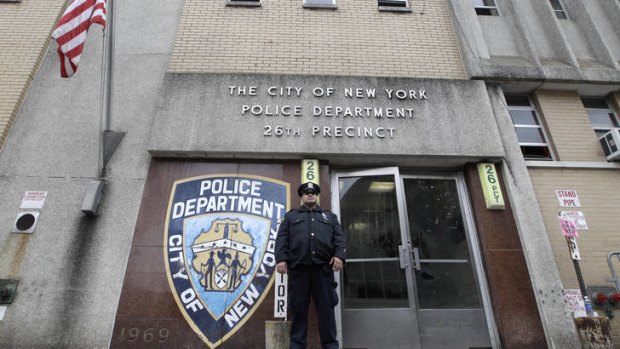 A police officer stands guard outside the 26th precinct where Gilberto Valle worked.