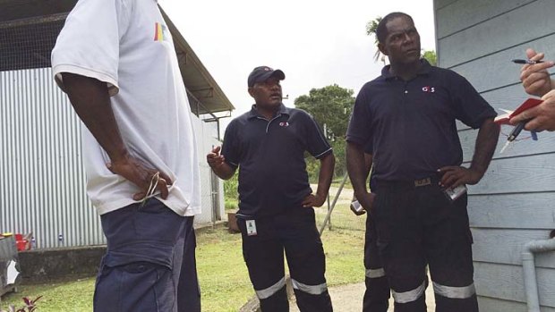 G4s guards preventing entry to the Manus Island morgue where the body of a man allegedly beaten to death at riots in the Detention centre.