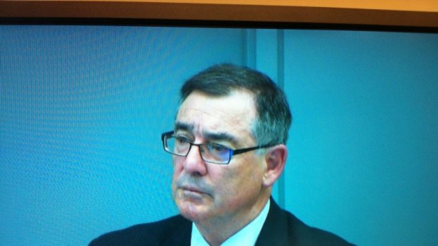 Former Swimming Australia CEO Glenn Tasker appears via video link at the Commission.