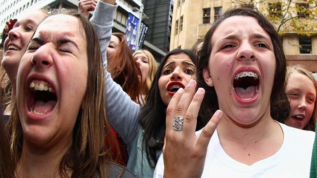Dedication ... One Direction fans scream for their heroes at Martin Place yesterday.