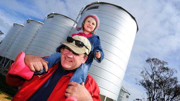 Happy wheat farmer David Drage of Warracknabeal with daughter Amelia.