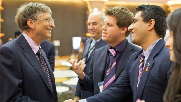 Mr Sheldrick introducing his friend, Young Australian of the Year 2013 Akram Azimi, to Bill Gates.