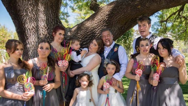 A family that mugs together stays together. A fun photo of Fiona and James Lester with their nine children at their wedding in 2013.