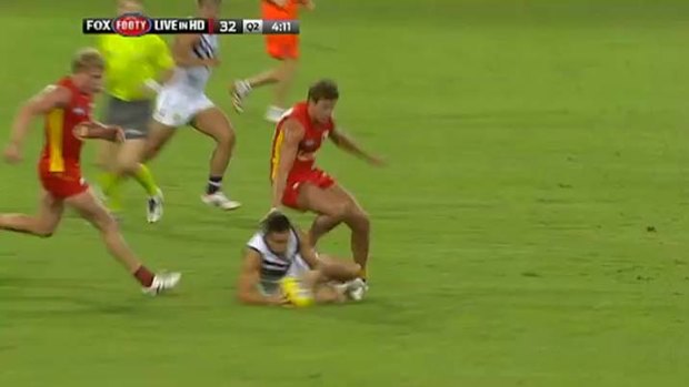 Tangled up: Fremantle's Greg Broughton and Gold Coast's David Swallow.