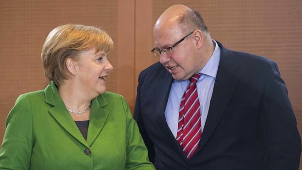 "I expect a very long and extremely difficult night of negotiations" ... German Environment Minister Peter Altmaier, right.