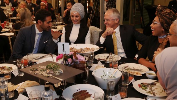 Waleed Aly (left) with his wife, Susan Carland (second left) attend Prime Minister Malcolm Turnbull's 2016 Iftar dinner.