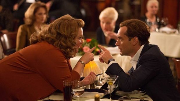 Jude Law manages to keep a straight face as Melissa McCarthy riffs in <i>Spy</i>.