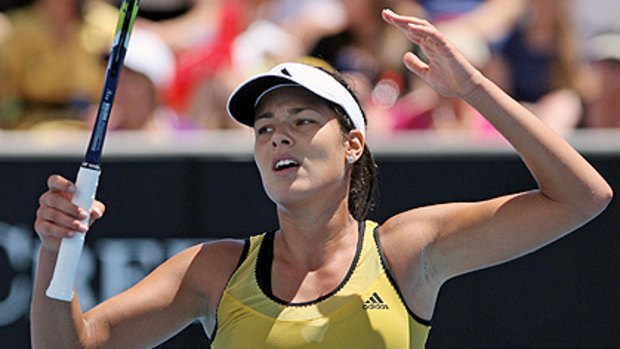 Ana Ivanovic reacts to a line call during her surprise defeat.