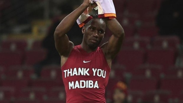Didier Drogba shows off his tribute to Mandela.