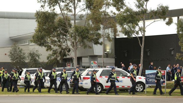 Police and paramedics  at the Metropolitan Remand Centre in Ravenhall where prisoners were rioting.