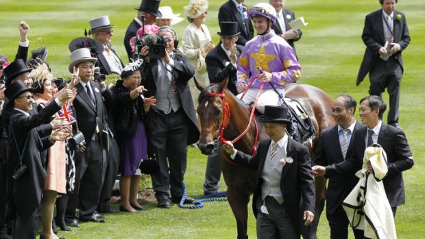 Hong Kong trainer Danny Shum leads Little Bridge, ridden by Zac Purton, back to scale after winning the King's Stand Stakes on the first day of the Royal Ascot carnival. Australian sprinter Ortensia was unplaced.