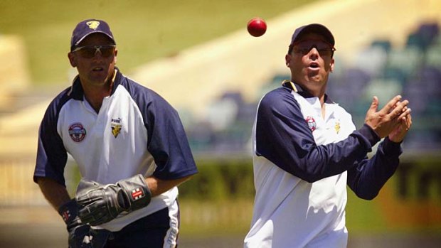 Old mates ... Shane Warne, right, and Darren Berry during slips training for Victoria.