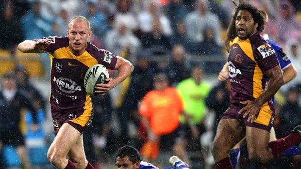 Darren Lockyer breaks through ... give him some space and he'll punish.