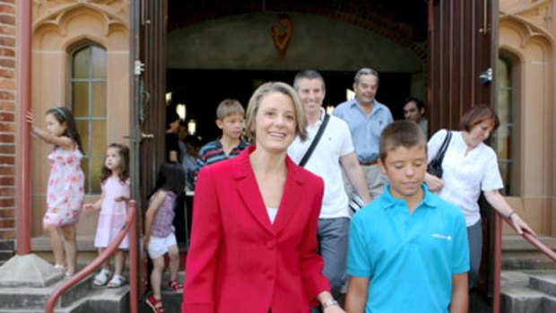No day of rest... Kristina Keneally and her family  leave Our Lady of the Rosary Catholic Church in Kensington yesterday after attending Mass.