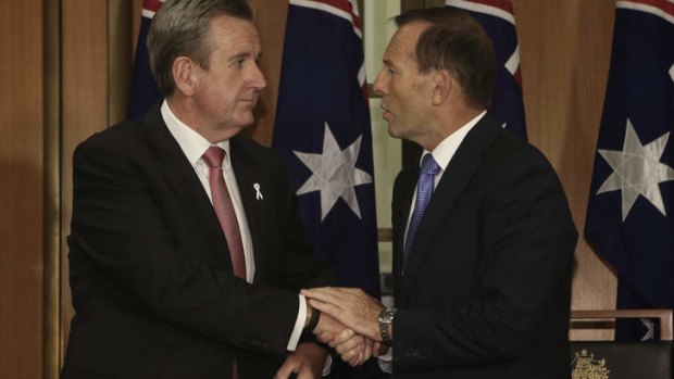 Prime Minister Tony Abbott and NSW Premier Barry O'Farrell sign the Murray-Darling Basin agreement.