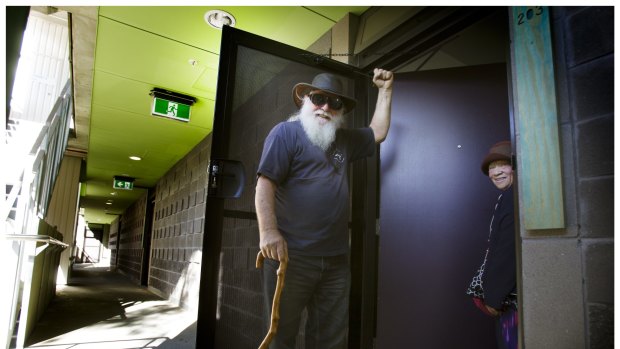  'Ugly', a resident of the Richmond Commission Flats,  celebrates his successful battle for security doors. 