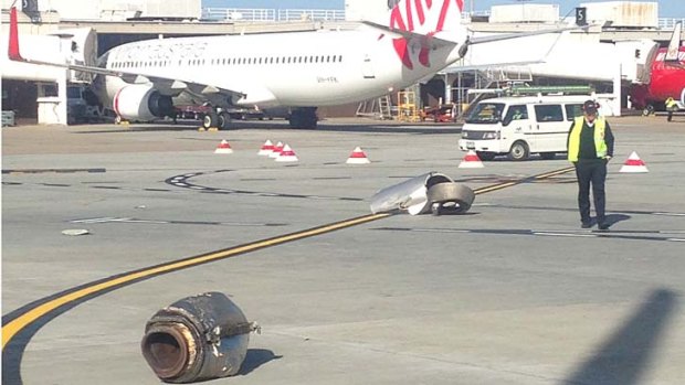 Parts of a plane shown on the tarmac after a collision at Melbourne Airport.