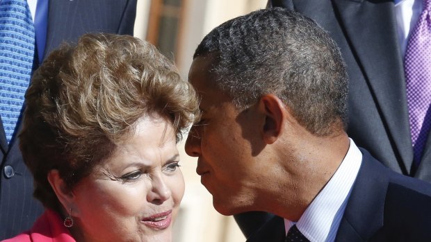 Brazils' President Dilma Rousseff, left, talks to US President Barack Obama.