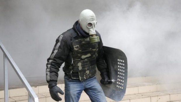 A pro-Russian activist stands during the mass storming of a police station in the eastern Ukrainian town of Horlivka. 