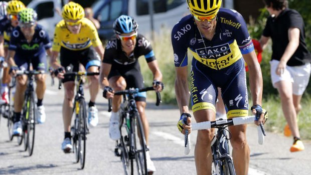 Overreach: Alberto Contador pushes for the lead from Chris Froome (left) and Richie Porte (middle) during stage 16.