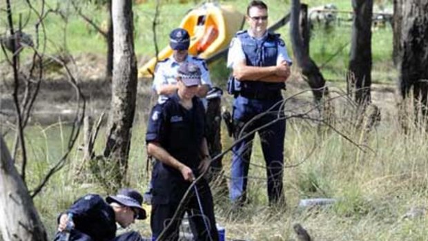 Police search the billabong for the boy.