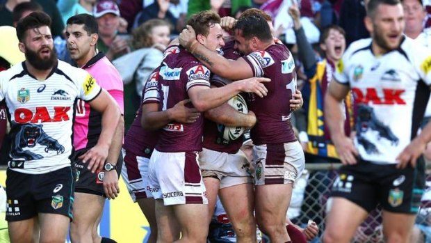 All smiles: Manly celebrate Tom Symonds' match-winning try.