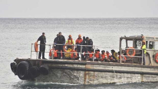 Rescued ... a barge carrying rescued suspected asylum seekers nears Christmas Island today.