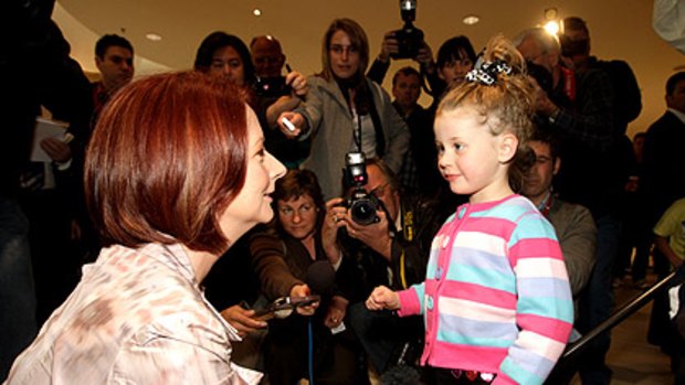 Julia Gillard greets Maddison Norton, 4½, during a shopping mall visit.