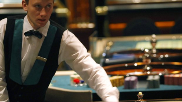 A dealer spins a roulette wheel at the Shangri La Casino in Moscow.