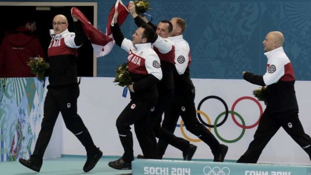 Victory lap: Men's curling champions Canada celebrate their gold medal victory.