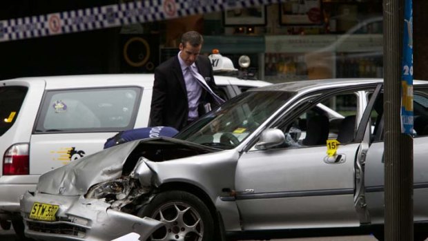 Police shot two boys after a stolen car was driven onto a footpath in Kings Cross early yesterday.