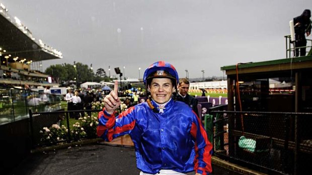 Craig Williams celebrates after winning the Cox Plate on Pinker Pinker.