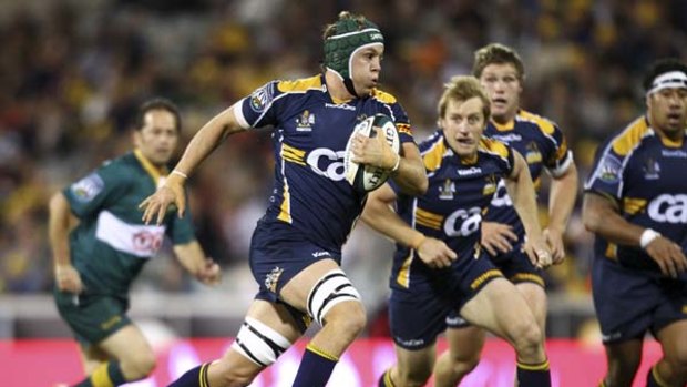 In vain ... Brumbies captain Stephen Hoiles takes the ball forward against the Hurricanes on Friday night. The Brumbies play the Waratahs at ANZ Stadium on Saturday night.