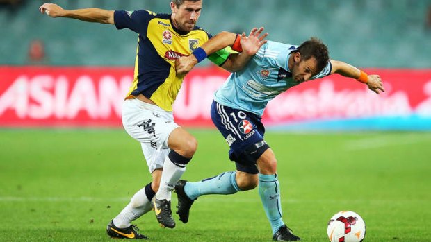 Alessandro Del Piero is put under pressure by Nick Montgomery of the Mariners.