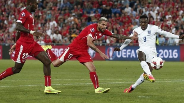 England's forward Danny Welbeck scores his second goal against Switzerland.