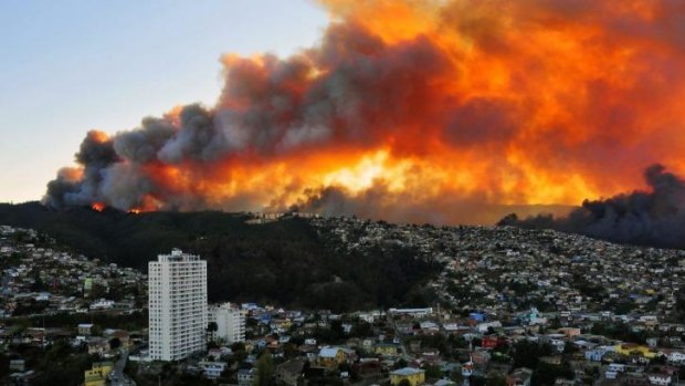 Red alert: Houses burn in Valparaiso, 110 kilometres west of Santiago.