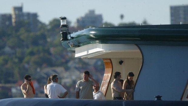 Old friends: James Packer in 2005 aboard Arctic P with Tom Cruise and Katie Holmes (right) and Tommy Davis (shirtless, far left).
