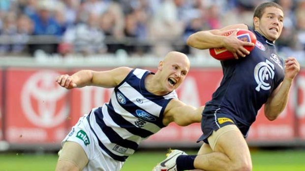 Gary Ablett collars Blue Aaron Joseph - one of his seven tackles for the match - but his 38-possession game did not impress coach Mark Thompson.